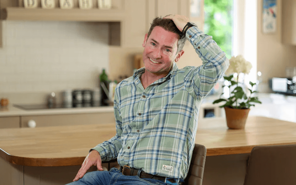 Dom Hogan touching his hairline before surgery